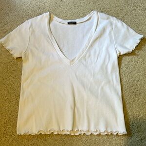 White short sleeve with ruffle detailing